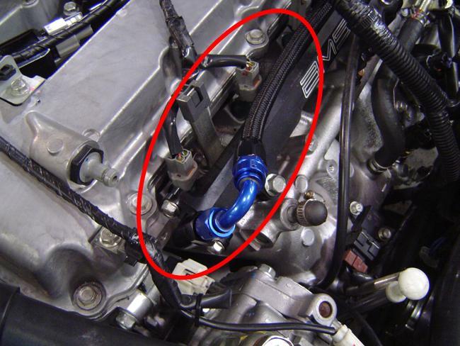 6) Install the -6 line connecting the passenger side of the fuel pressure regulator to the fitting that was installed on