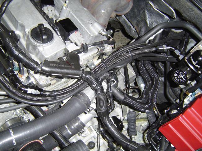 7) Install the vacuum line from the fuel pressure regulator to the port on the intake manifold and use supplied zip ties to secure this and the return line as needed.