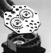 3. All gasket material adhering to the head, valve plate, or crankcase; should be carefully removed in such a manner that the machined sealing surfaces are not scratched or nicked.