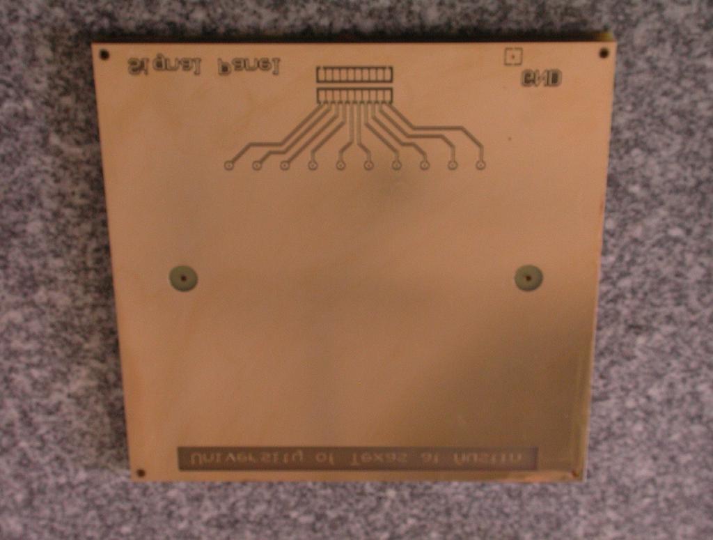 Therefore, beam profile measurement is appropriate. This photo shows the interior side of one of two printed circuit boards, 8 x8 in size, with gold-plated copper electrodes on the inside.