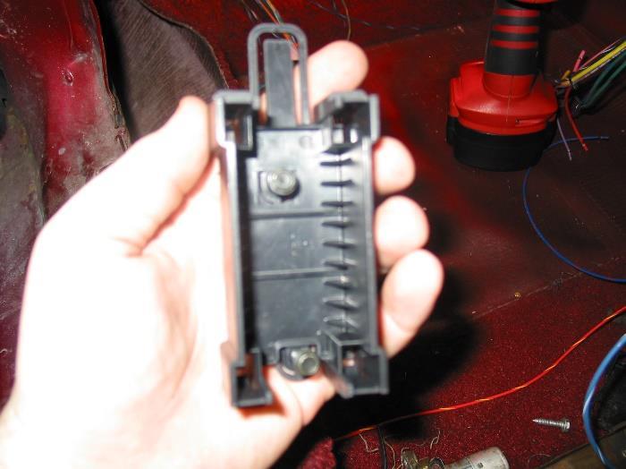 6.2.1 Mount the base of the fuse block with the two self tapping screws from the parts kit.