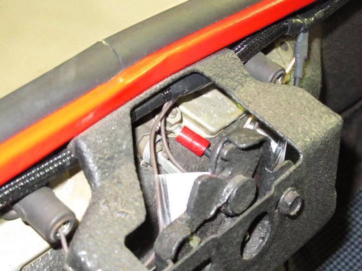 The remainder of the harness will route above the passenger tail light buckets, into the factory harness retainer tab and down to the tail bucket to the right side marker light.