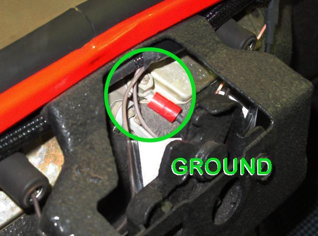 Connect this black ground wire to a good clean chassis ground source, such as one of the mounting bolts for the license plate lens or the trunk latch.