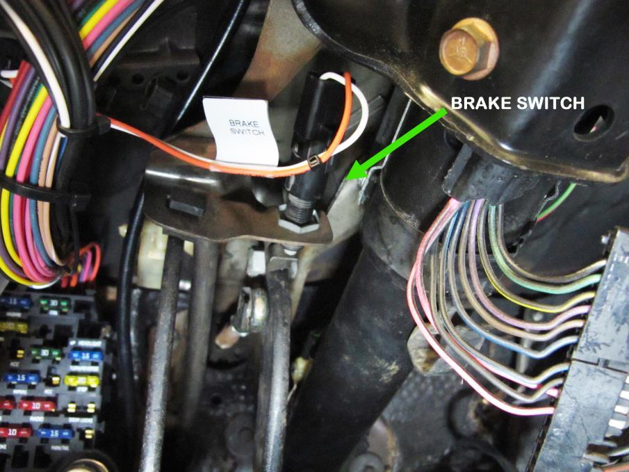 Route the brake switch wires to the brake switch and connect using the preinstalled connector or loose piece insulated terminals provided in the parts kit.