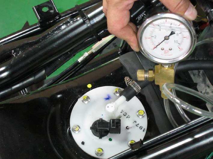 7. Fuel System> Fuel Pump XCITING 400i Fuel Output Pressure Turn the key to the OFF position. Use a fuel hose clamp A120F00031 as shown. Disconnect the fuel hose from the fuel injector.