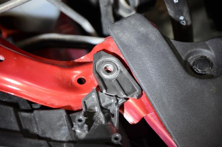 If necessary, use the same prying tool to gently pry the A/C hard line inward towards the engine.