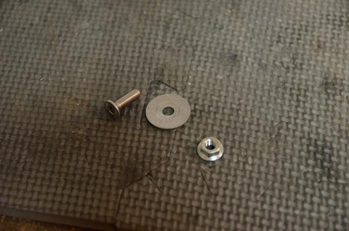 20. Locate the M6 countersink screw, fender washer, and M6 nut in the kit. These will be used in the next step. 21.