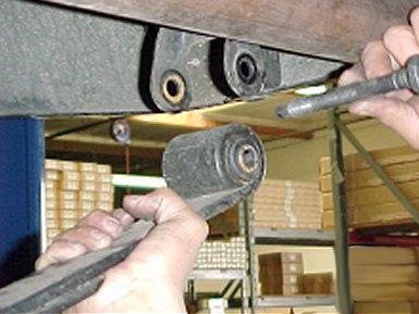 You may now remove the bolts holding the leaf springs at either end, and then remove the