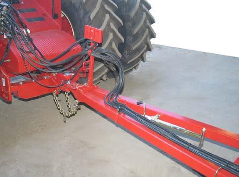 Attach safety chain to the tractor drawbar support or other specified anchor location with the appropriate parts. Hitching to Tractor Ensure swinging drawbar is locked in the centre position.