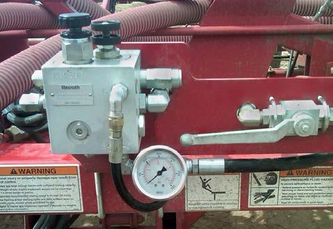 With the Contour Air Drill moving forward, lower openers into the ground. Hold tractor hydraulic lever until the maximum preset operating pressure is reached (see Setting Maximum System Pressure ).