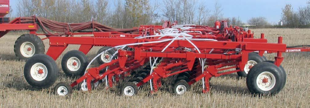The rear tires may even leave the ground while traveling through sharp gullies; this is normal, and it will not affect the seed depth control of the openers.