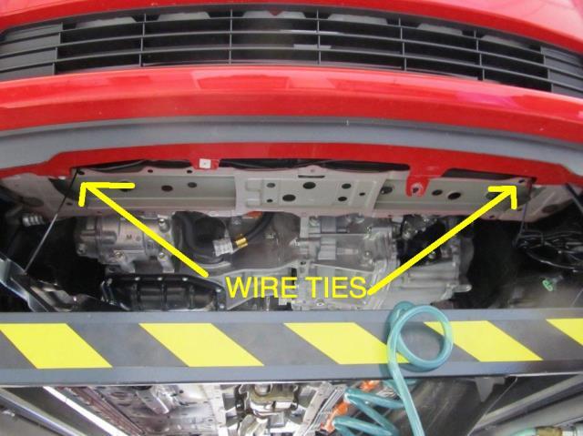 Run right side of wire harness under skid plate and secure with wire ties (picture