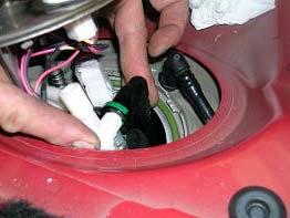 STEP 12: Carefully lift the fuel pump out of the fuel tank enough to access and
