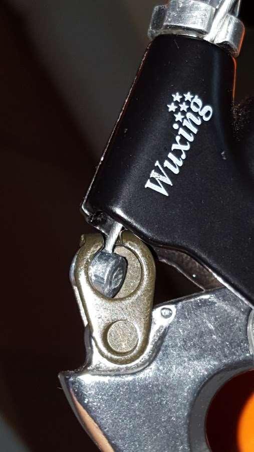 Insert the ball end of the wire in the brake lever housing as shown in the
