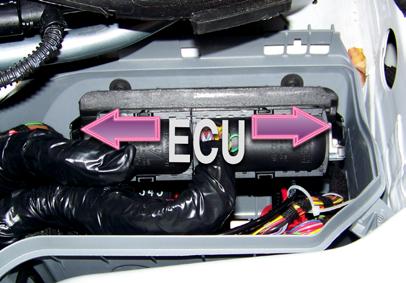 running the vacuum/boost hose Step 15 Removing the cover exposes the ECU (Engine Control Unit) inside the main power distribution