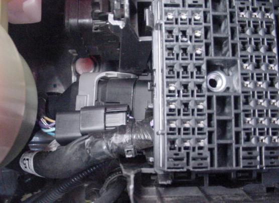 Figure 10 15. Refit connector to lower fuse box.
