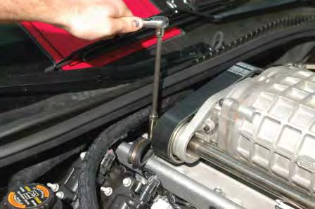 Install this short end onto the driver side barb of the supercharger intercooler using one of the supplied worm gear clamps.