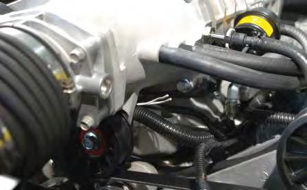 Route the two white IAT wires on the passenger side of the supercharger lid forward and under
