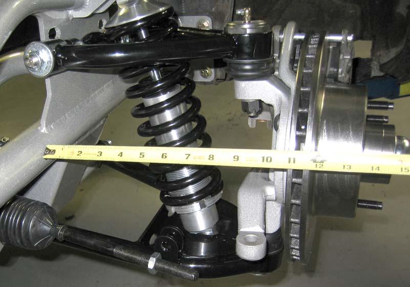 Install the 5/8 inch lock nut and torque 100 foot lbs. No spacers are used between the rack and the brackets on the crossmember. 17. Rack & Pinion Centering Procedure.