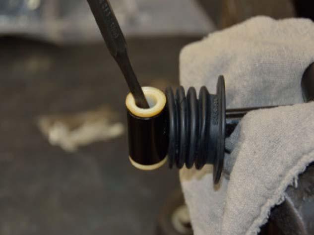32. Remove the two (2) bushings and the rubber boot from the old shift rod,