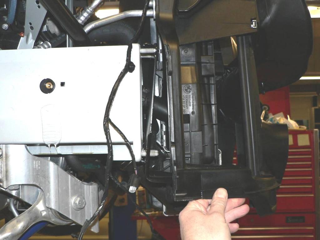 Pull the right side of the radiator support assembly forward just far enough to