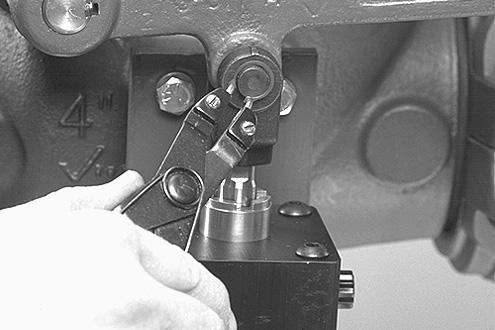 Install the spring plate parallel to the lever, as shown above.