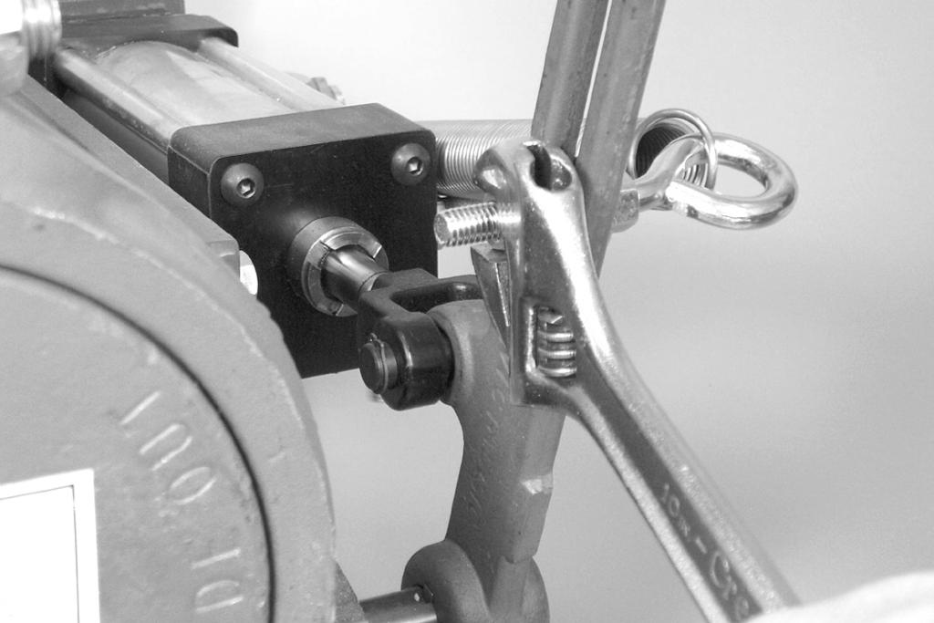 8. Tighten the nut to secure the spring assembly to the lever. 11.