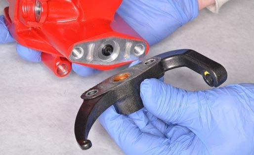 Install the two parking brake bracket bolts and tighten them to
