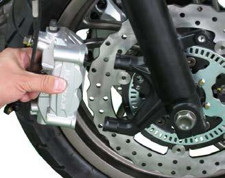 Discard the two sealing washers. The brake calipers are each mounted to the front fork with two bolts.