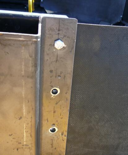 Place the brackets with one side lining up with the holes and the other is up against the panel with the bracket extending down past the factory extension.