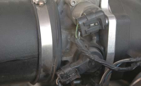 25. On late model vehicles, disconnect the Idle Air Control (IAC) and Throttle Position Sensor (TPS)