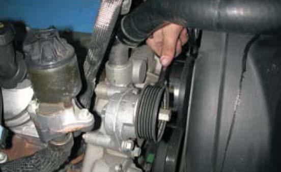 Using a 15mm tensioner wrench or breaker bar, remove the stock serpentine
