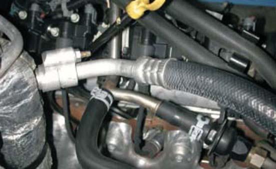 49. Disconnect the two air injection hoses from the other end of the tube and