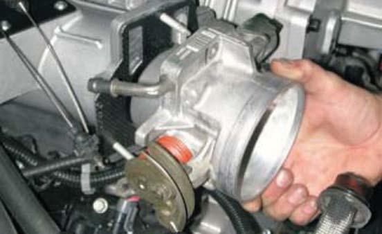 89. Using supplied gasket, mount throttle body using
