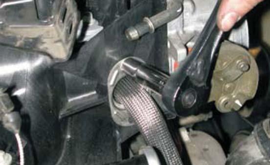 Using a 10mm socket wrench remove the 6mm bolt holding the (EGR)