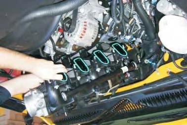 36. Carefully remove the intake manifold assembly and set