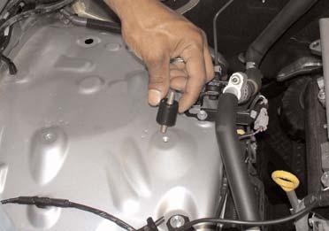 Press the new 18 inch, 4mm vacuum line over the fuel pressure regulator port.