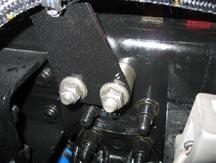 In this case, spacers must be installed between the frame rail and the left-side radiator stay rod bracket to provide clearance between the stay rod and the fan ring.