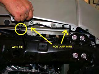 On the left side of the vehicle, drop wire harness to reach out the