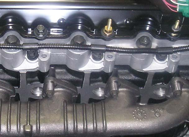 Rocker Arm Carrier (RAC) Bolts The cylinder head is now manufactured without the four outer rocker arm carrier (RAC) hold down bolt holes.