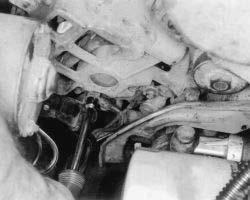 Fig. 3: Disconnecting alternator wiring Fig. 4: Removing the pivot bolt and nut Fig.