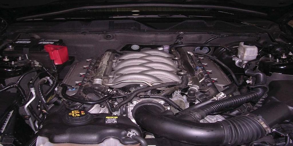 the Boss 302 intake) Remove intake cover from intake.