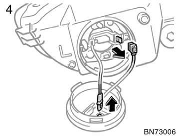 4. Disconnect the cords. 5. Release the bulb retaining spring and remove the bulb.