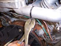 Remove the stock throttle lever assembly by cutting the assembly with a hack saw.