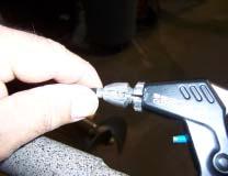 Remove the slack from the throttle cable by unscrewing one side of the cable extender located three inches from the throttle lever.