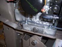 Route the carburetor overflow tubes as shown. Check all fitting and remove all your tools from the engine. If you have a fuel line bulb, gently pump fuel into the carburetor.