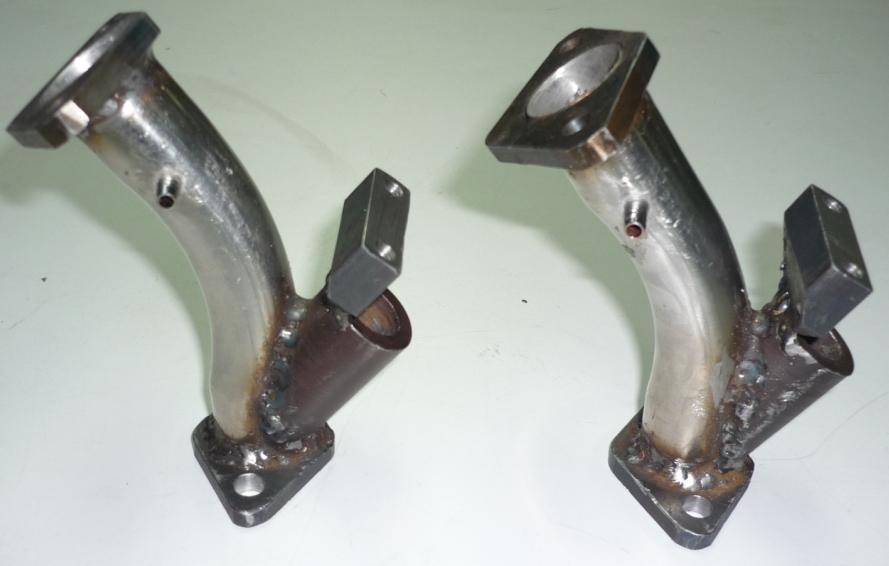 68 48 FIGURE 3. Fabricated intake manifold with different fuel injector angles. Measurements were taken for torque, actual speed, air-flow, air-inlet pressure and fuel consumption.