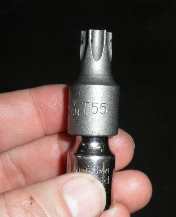 Drain and refill the transmission: 9. Use the same torx # 55 to loosen then transmission drain plug that s located at the bottom center of the transmission.