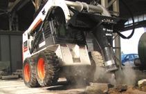 .. Dual steering levers control the drive functions, while dual foot pedals control the loader lift and tilt.