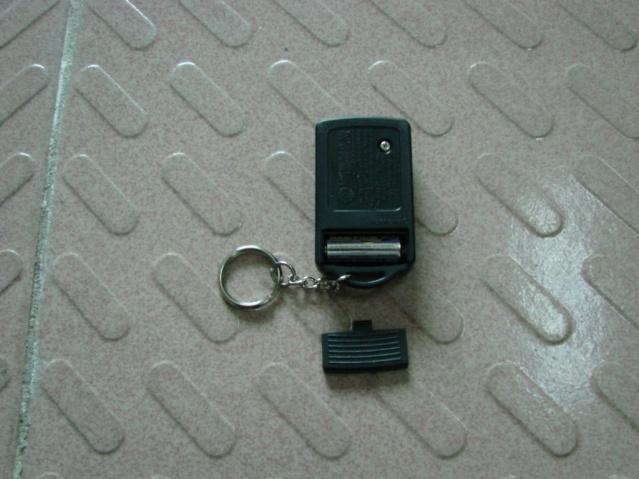 THE REMOTE TRANSMITTER REMOVE THE 12 VOLT, TYPE A23 BATTERY